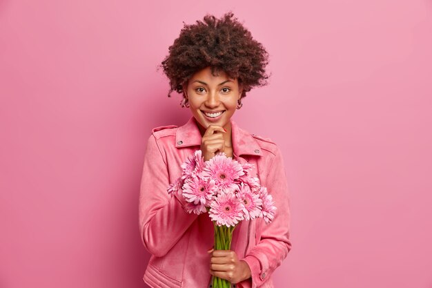 Young beautiful woman with curly hair isolated