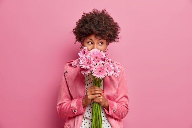 Young beautiful woman with curly hair isolated