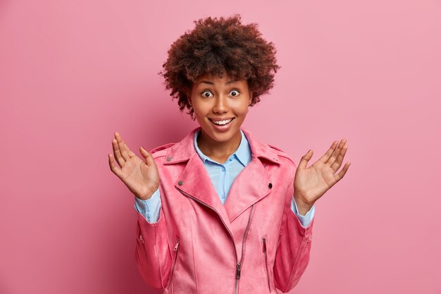 Young beautiful woman with curly hair isolated