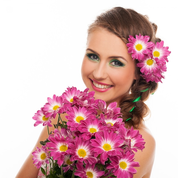 Young beautiful woman with flowers in hair