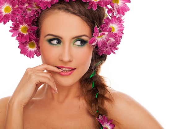 Young beautiful woman with flowers in hair