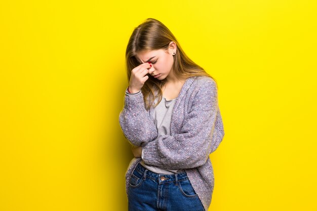 Young beautiful woman with headache isolated.