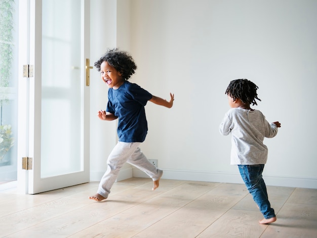 Free Photo young black boys playing in their new house