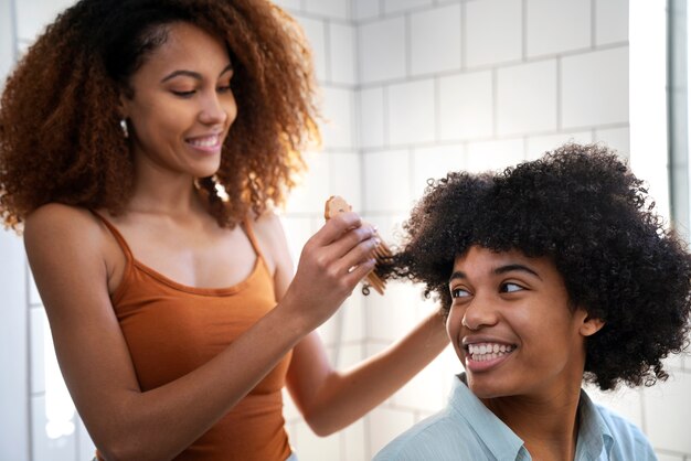 Young black people taking care of afro hair