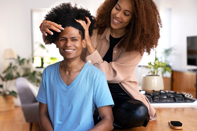 Young black people taking care of afro hair