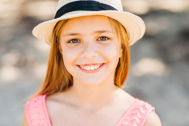 Young blonde looking at camera on beach