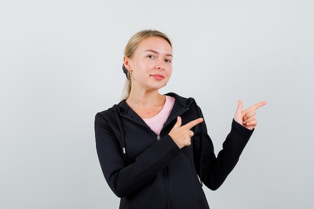 Young blonde woman in a black jacket