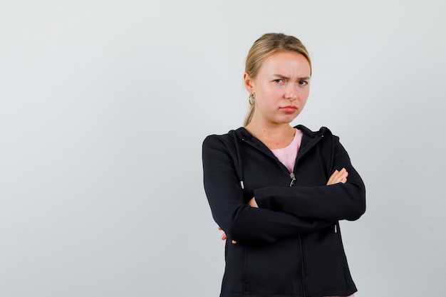 Free Photo young blonde woman in a black jacket