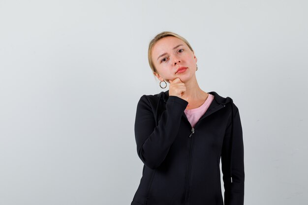 Free Photo young blonde woman in a black jacket