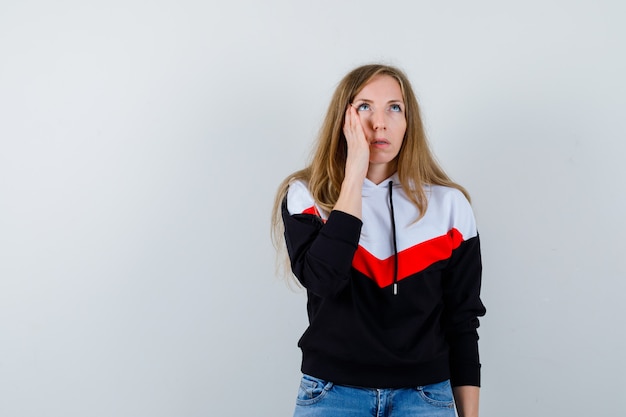 Free Photo young blonde woman in a jacket and jeans