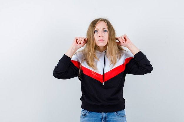 Free Photo young blonde woman in a jacket and jeans