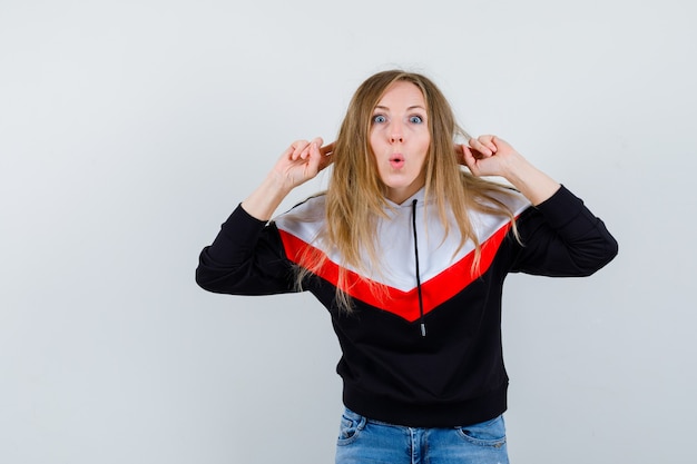 Free Photo young blonde woman in a jacket and jeans