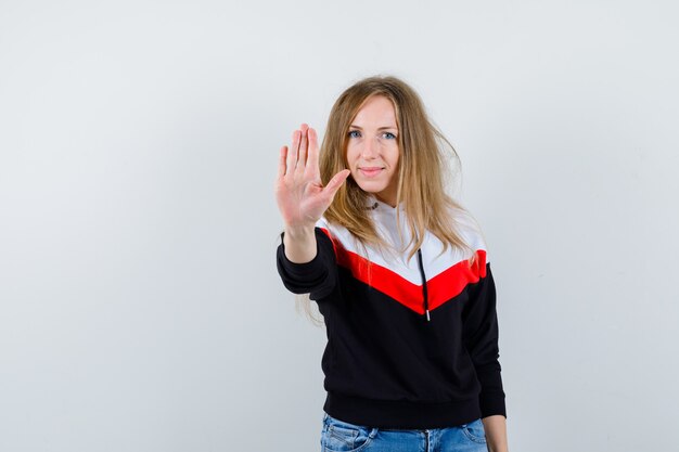 Young blonde woman in a jacket and jeans