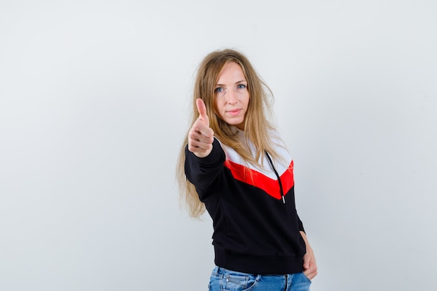 Free Photo young blonde woman in a jacket and jeans