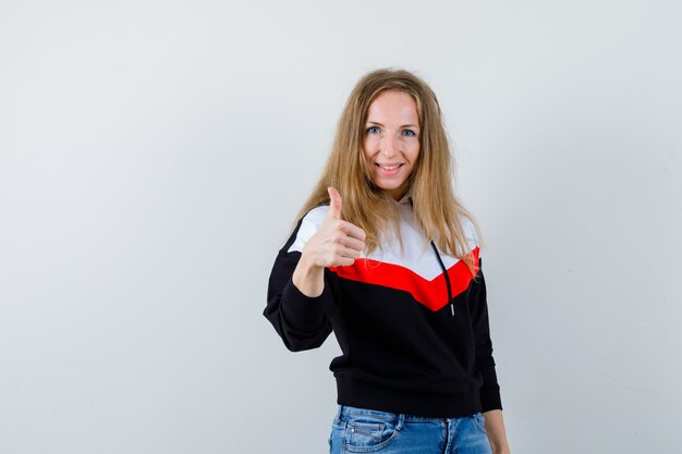 Young blonde woman in a jacket and jeans