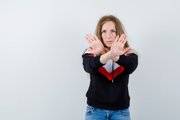 Young blonde woman in a jacket and jeans