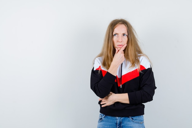 Free Photo young blonde woman in a jacket and jeans