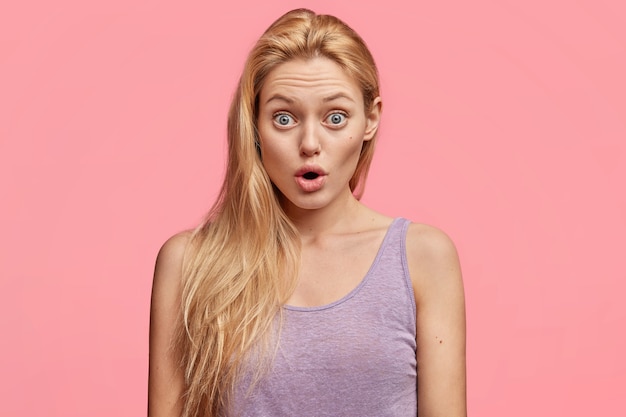 Free Photo young blonde woman in purple top