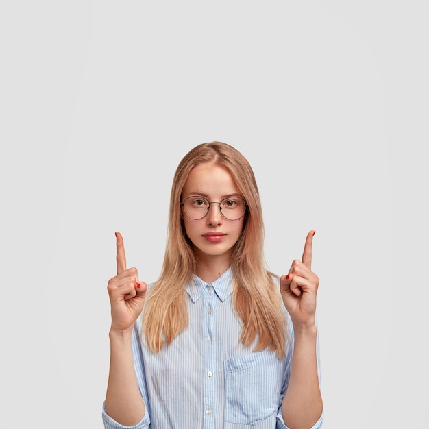 Young blonde woman wearing blue shirt