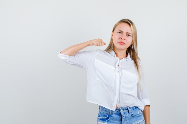 Young blonde woman in a white shirt