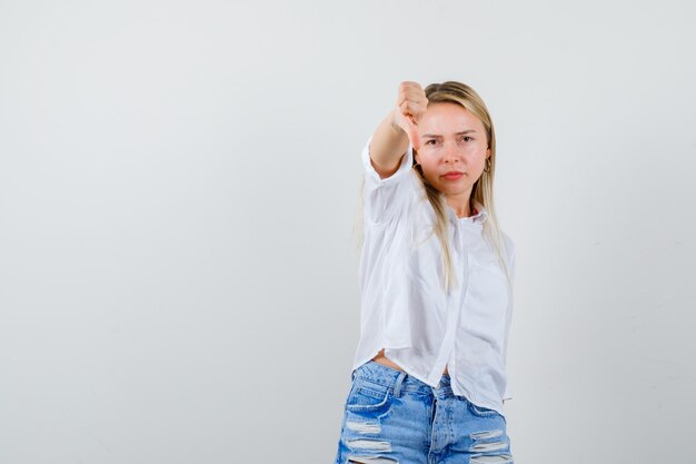 Young blonde woman in a white shirt