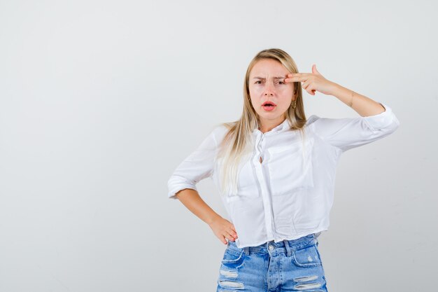 Young blonde woman in a white shirt