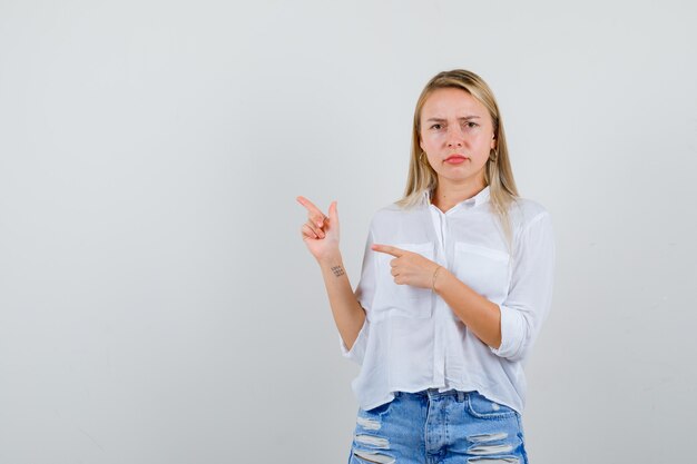 Young blonde woman in a white shirt