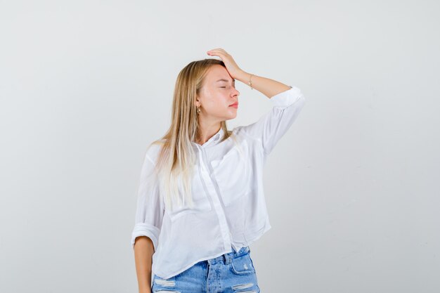 Young blonde woman in a white shirt