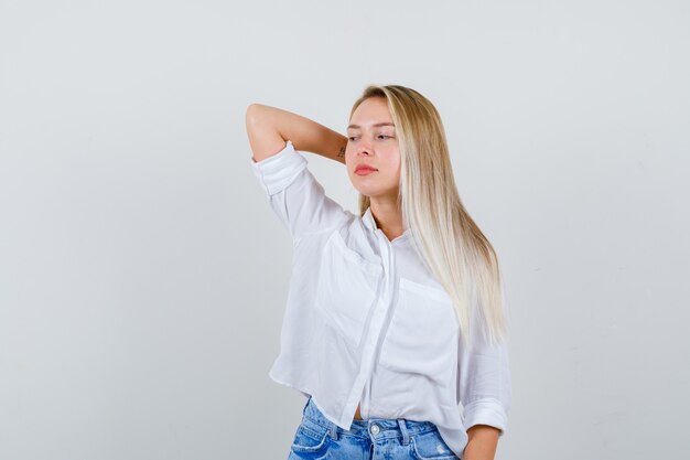 Young blonde woman in a white shirt