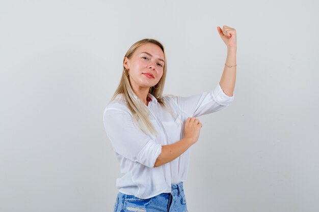 Young blonde woman in a white shirt