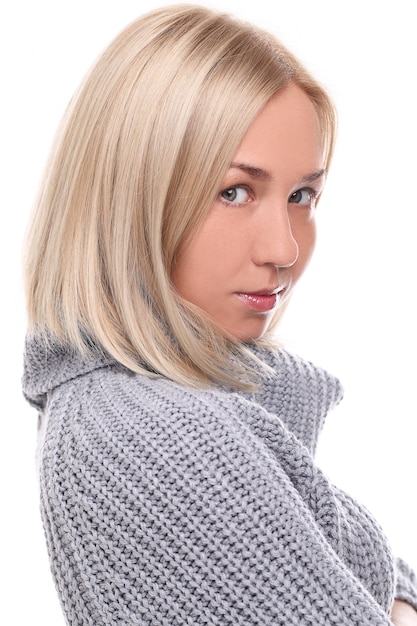 Free Photo young blonde woman with warm sweater