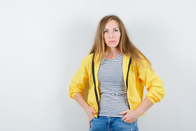 Young blonde woman in a yellow jacket