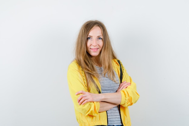 Young blonde woman in a yellow jacket