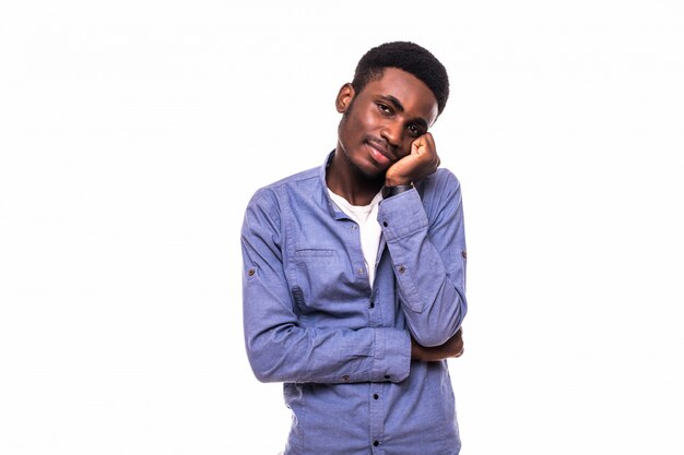 Young bored african man isolated on white wall. Negative human emotions, facial expressions, feelings, body language