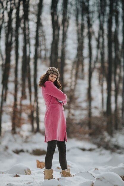 Young Bosnian woman posing in the forest in the winter