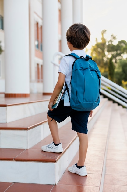 Free photo young boy getting back to school