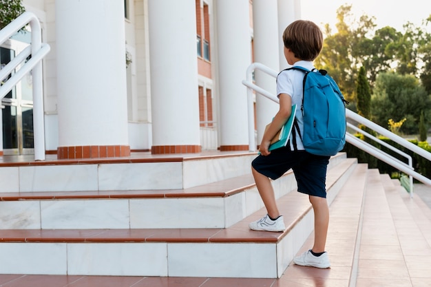 Free photo young boy getting back to school