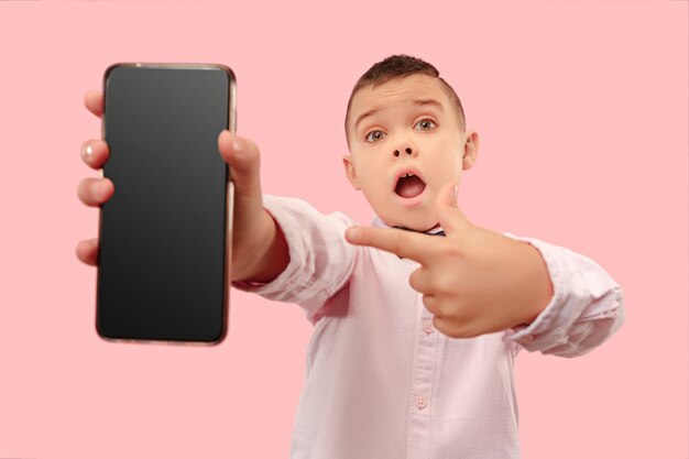 Young boy holding blank smartphone