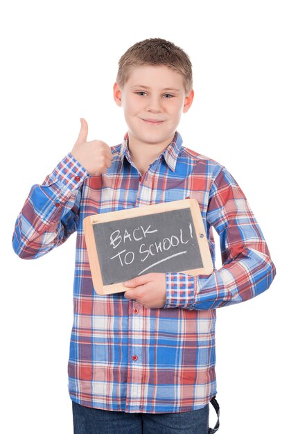 Young boy holding slate on white space