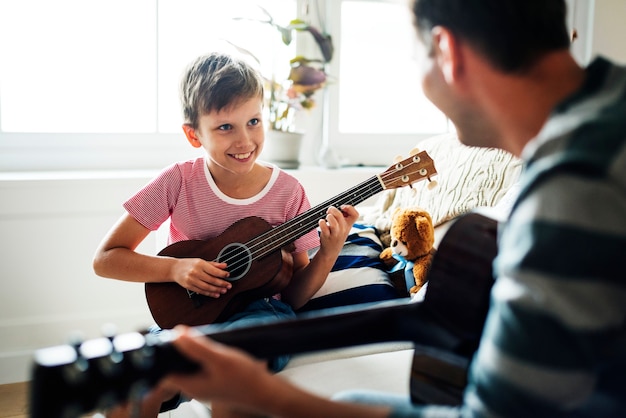 Young boy playing guitar