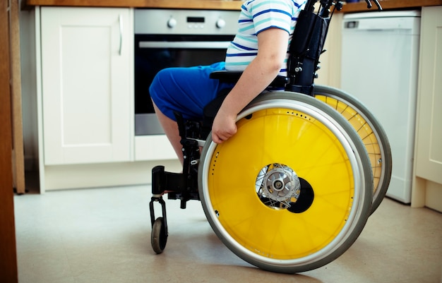 Free Photo young boy in a wheelchair