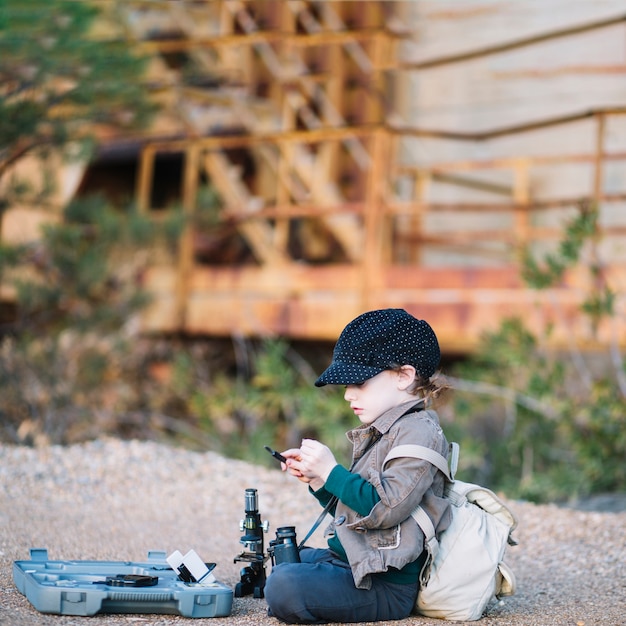 Free photo young boy with microscope