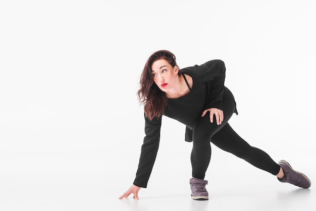 Free Photo young break dancer dancing over white background