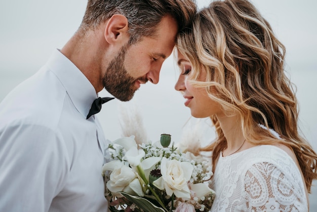 Young bride and groom having a beach wedding