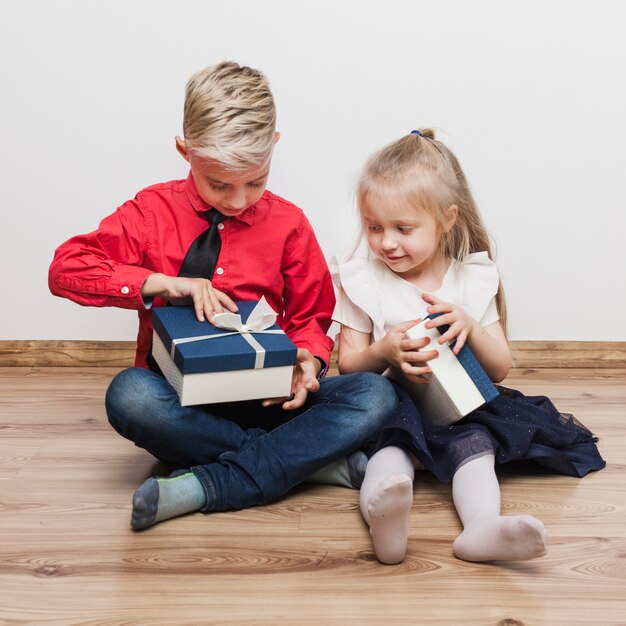 Young brother and sister with present box