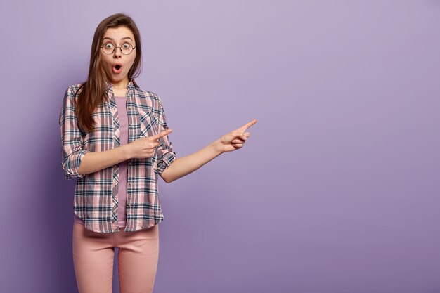 Young brunette woman in colorful clothes