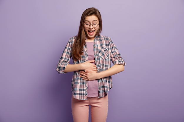 Young brunette woman in colorful clothes