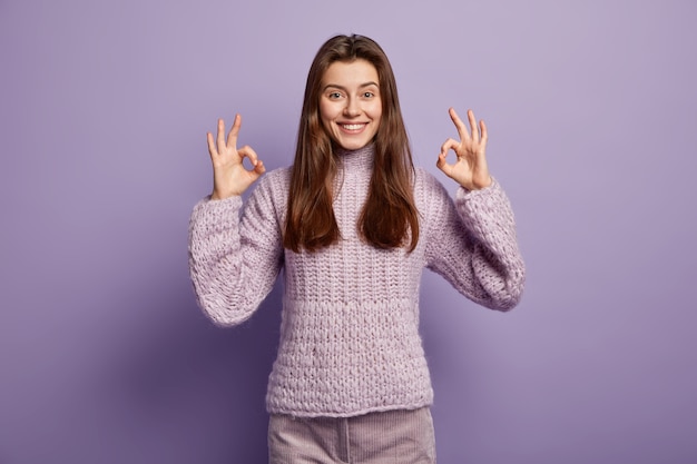 Young brunette woman in cozy winter clothes