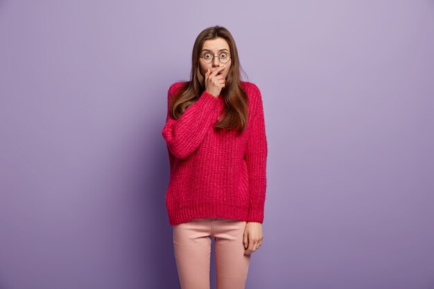 Young brunette woman in cozy winter clothes