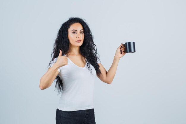 Young brunette woman holding a mug